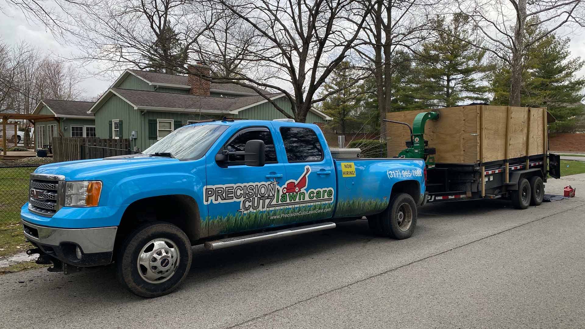 Precision Cutz Lawn Care truck at a property in Fishers, IN.