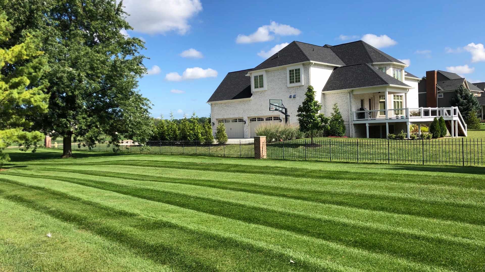 Lawn with fresh mow patterns in Meridian Kessler, IN.