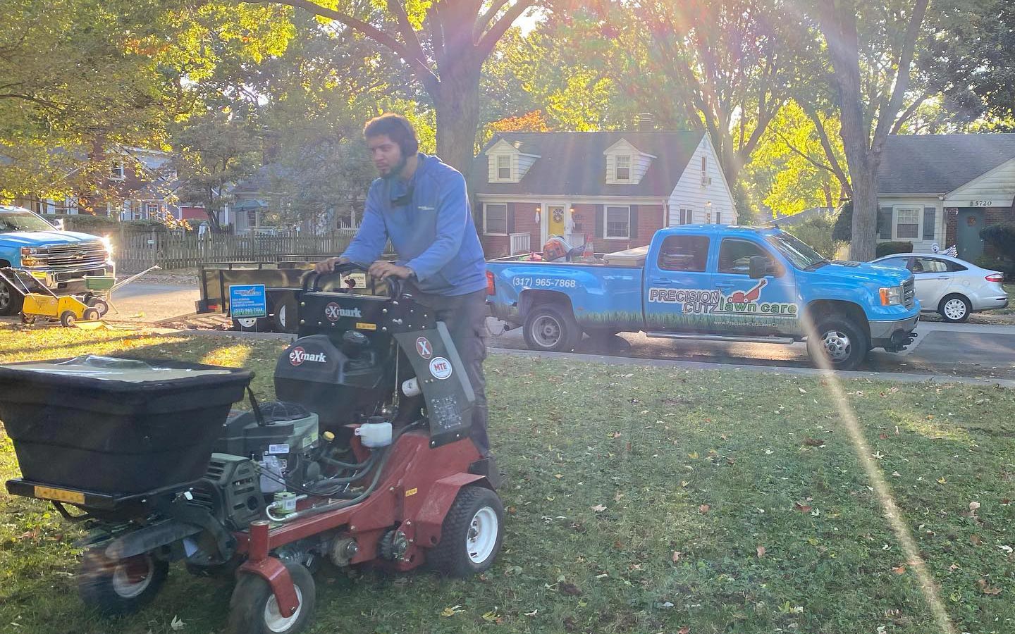 Precision Cutz Lawn Care employee and lawn machine in Zionsville, Indiana.
