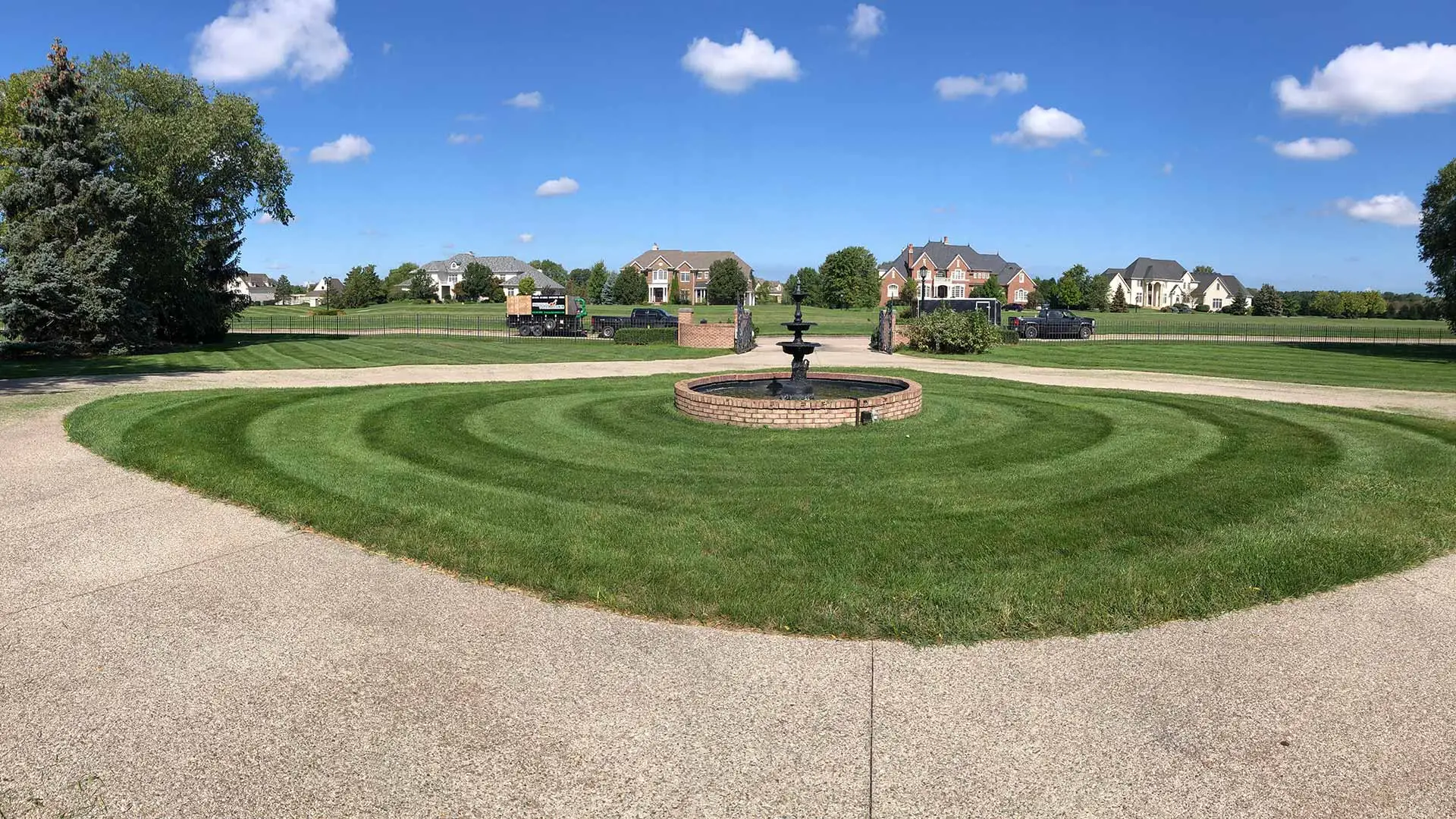 Ringed mowing lines around a landscape feature in Westfield, IN.