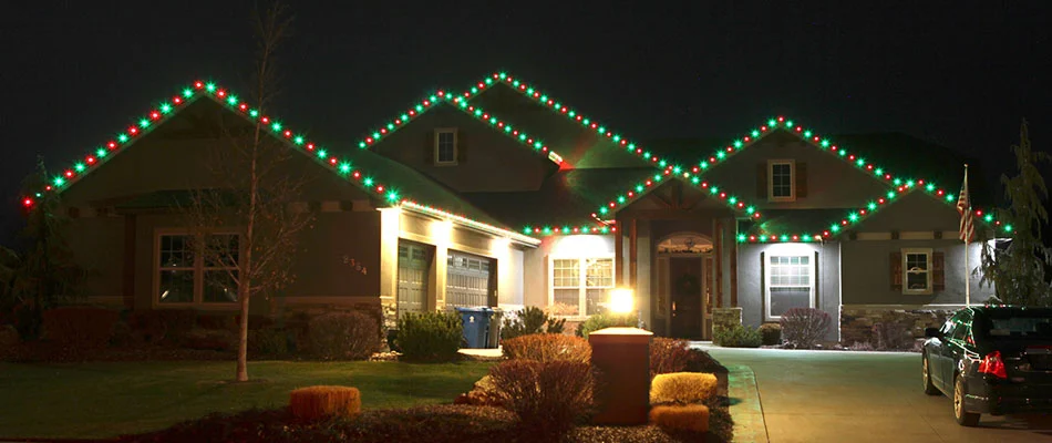 Fishers, Indiana home with red and green Christmas lights.