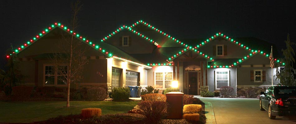 Christmas holiday lights installed along the roof line of a home in Fishers, IN.