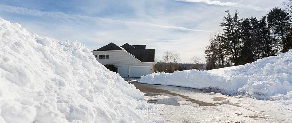 Carmel, Indiana home with snow cleared from driveway.